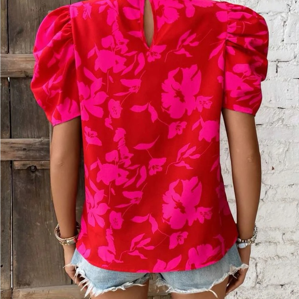 Red and pink floral top. Ruffle sleeves and collar. 100% polyester.